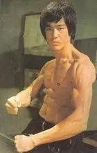 Bruce Lee showing off lean muscle